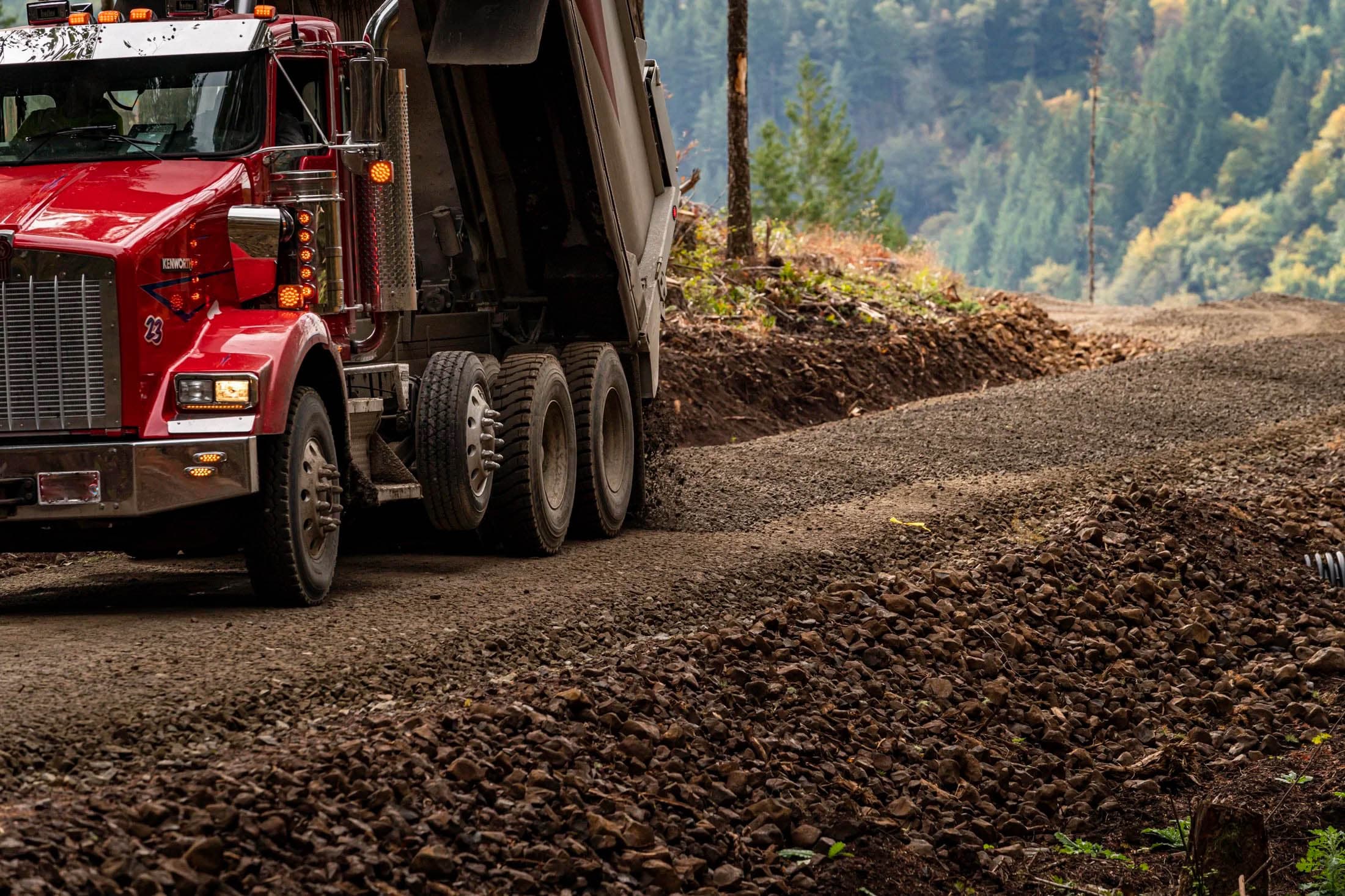 Dump truck delivering gravel